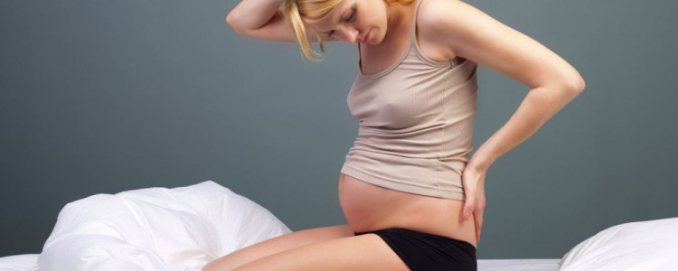 Как  бороться с болью в спине во время беременности?